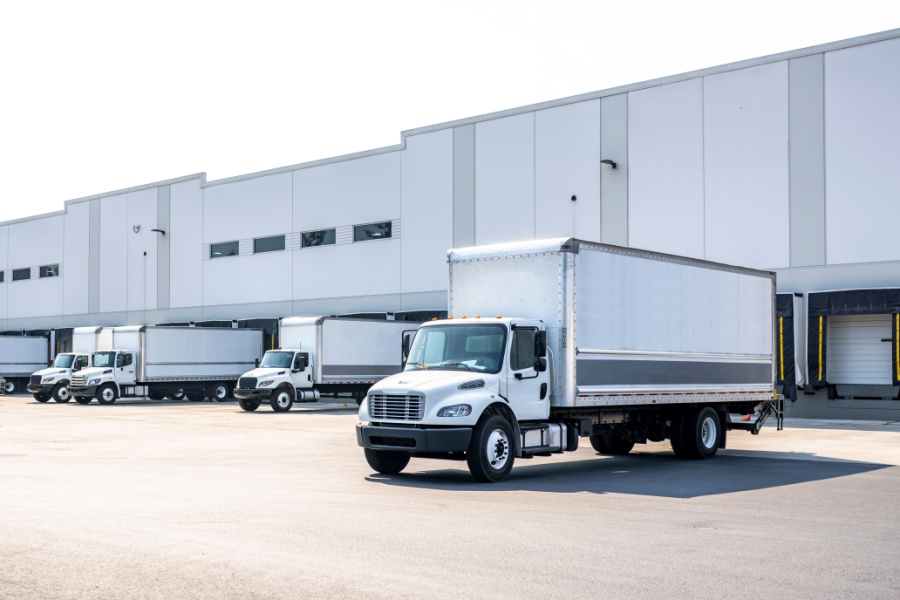 Medium duty trucks at a warehouse