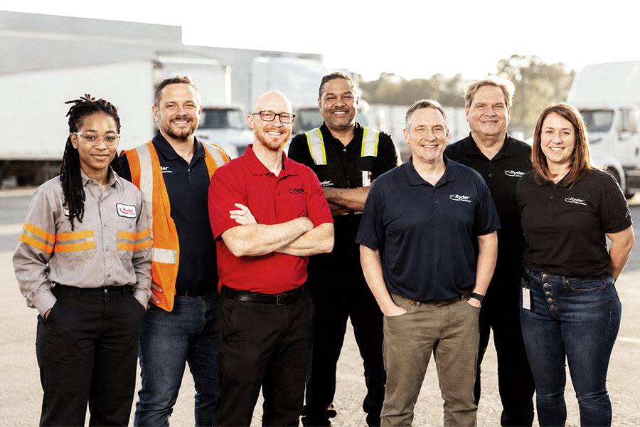 Group of Ryder Employees posing in front of a Ryder truck