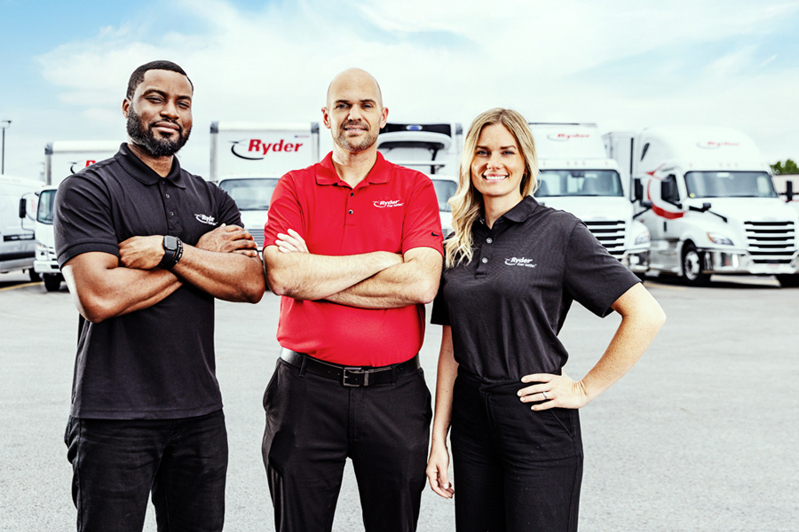 The Ryder fleet safety and compliance team in front of Ryder trucks