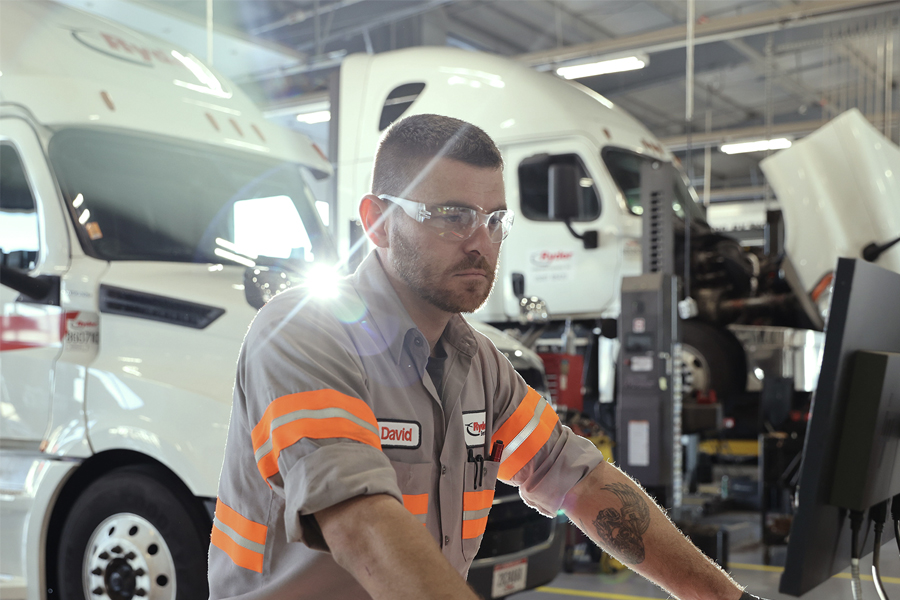 Ryder mechanic performing maintenance on a fleet of leased trucks