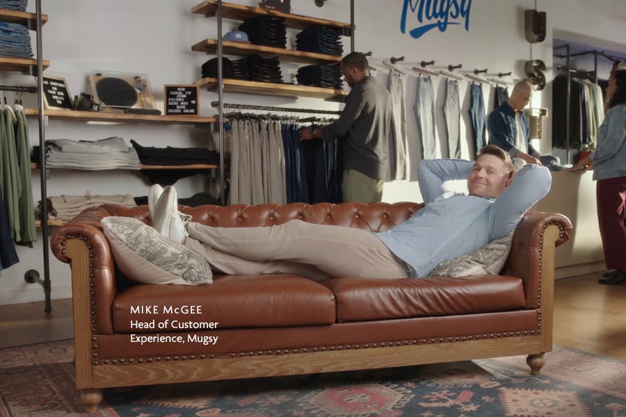Mike McGee of Mugsy relaxing on a couch