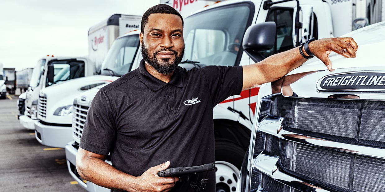 Ryder truck driver in front of his truck