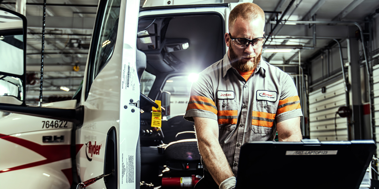Ryder technician performing maintenance on a semi truck