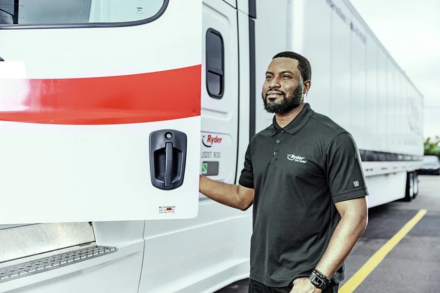 Ryder truck driver opening the door to his semi-truck