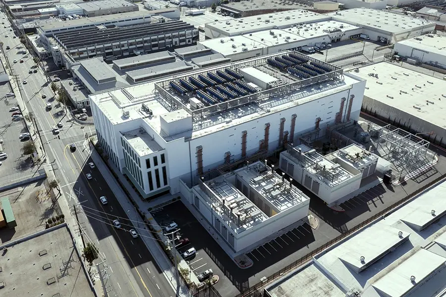 Aerial view of a completed data center facility with rooftop cooling units