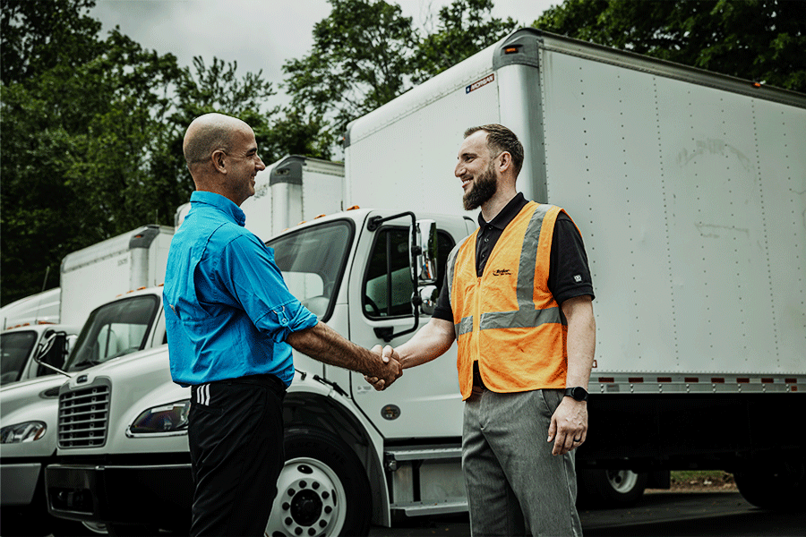 Ryder employee shaking a customer's hand