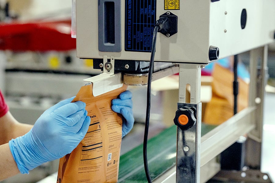 a robot sealing a sachet packet