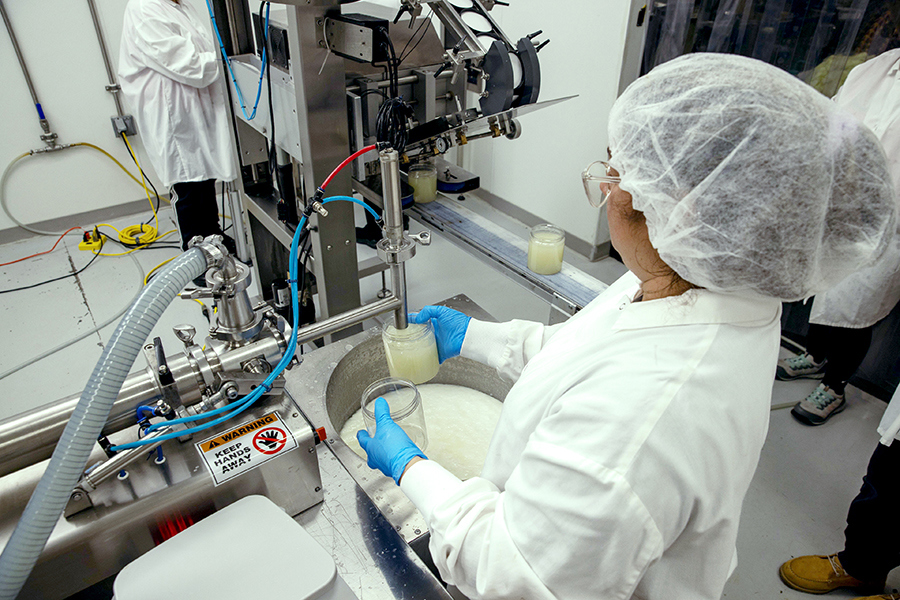 A food scientist performing quality control at a Ryder co-manufacturing facility