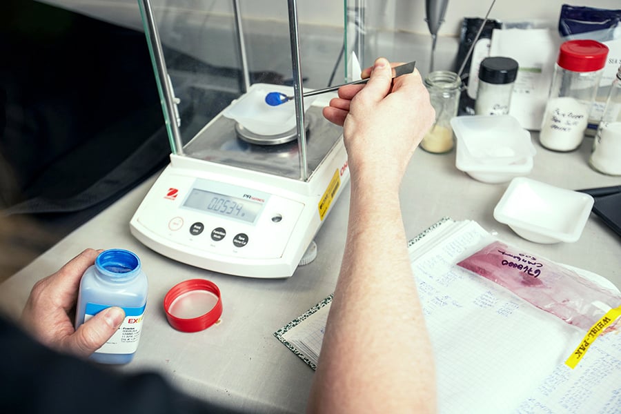 a scientist running tests in a lab
