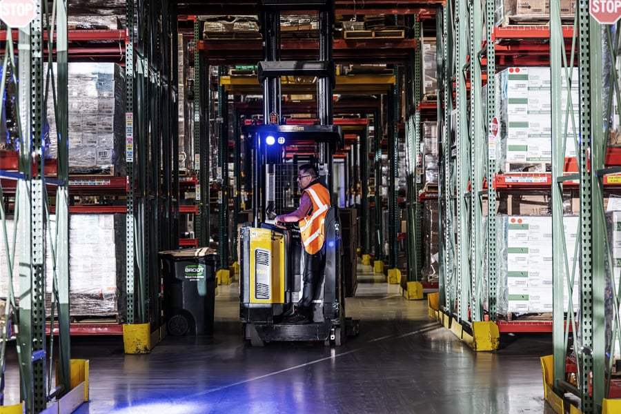 Ryder associate managing inventory in a multi-client shared warehouse Ryder associate managing inventory in a multi-client shared warehouse