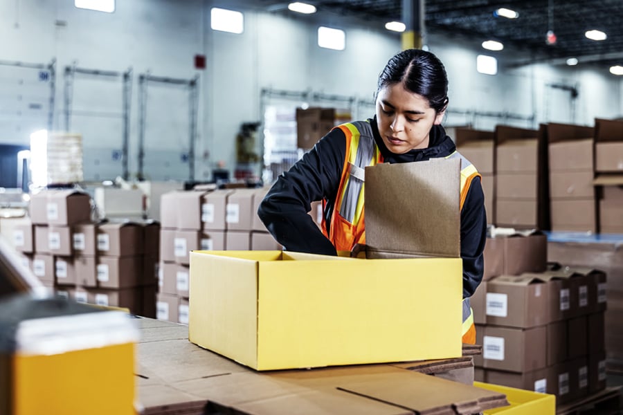 Ryder associate performing kitting and packaging value-added services Ryder associate performing kitting and packaging value-added services
