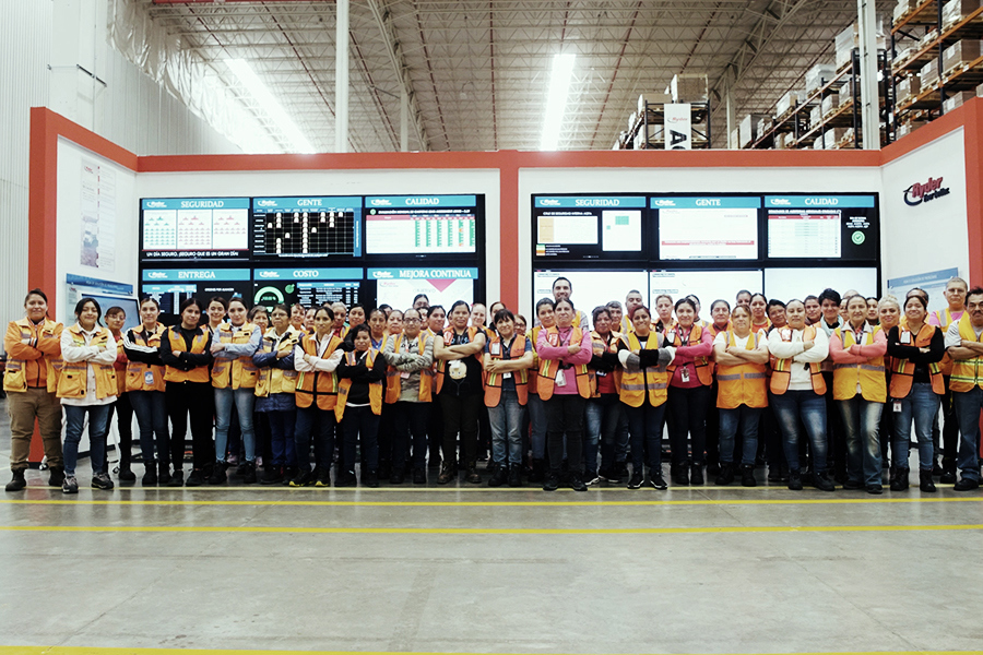 large group of employees forming half circle