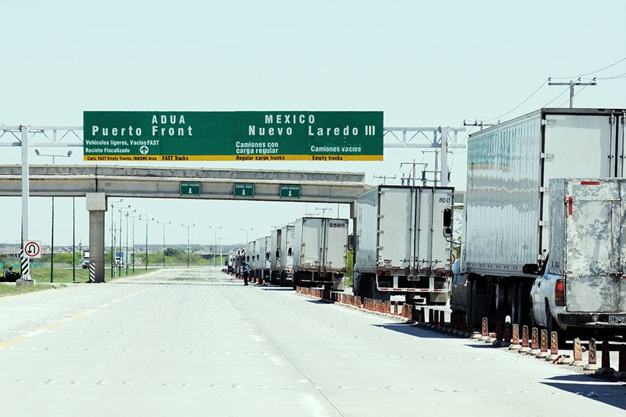 trucks crossing the border from US to Mexico for nearshoring services