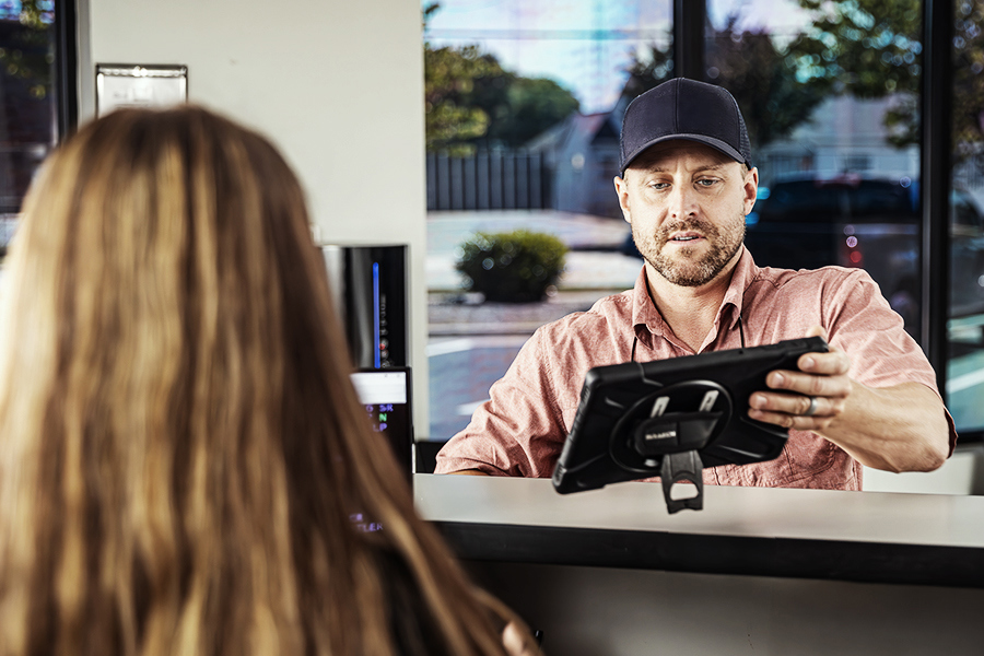 A customer using the quick pick up and drop off rental perk