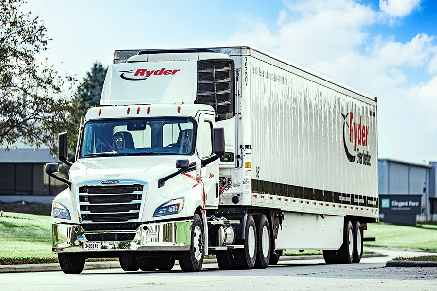 Ryder branded refrigerated semi truck parked outside a commercial facility Ryder branded refrigerated semi truck parked outside a commercial facility