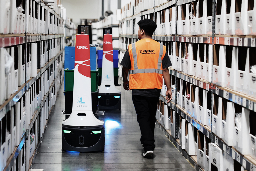 Autonomous mobile robots moving inventory in a Ryder automated warehouse