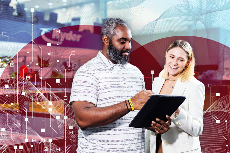 A Ryder employee helping a customer integrate Ryder technology with their business software