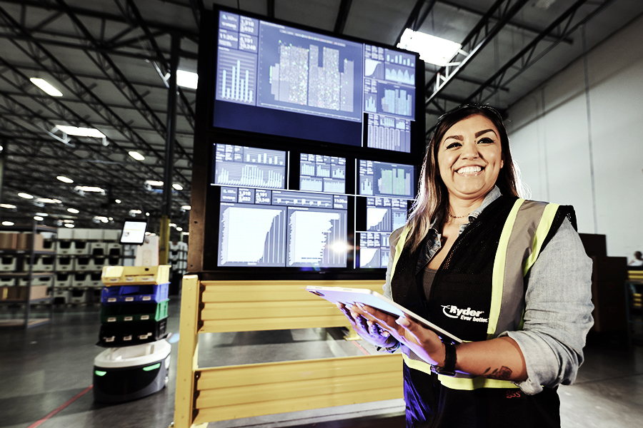A Ryder employee utilizing Ryder technology and automation