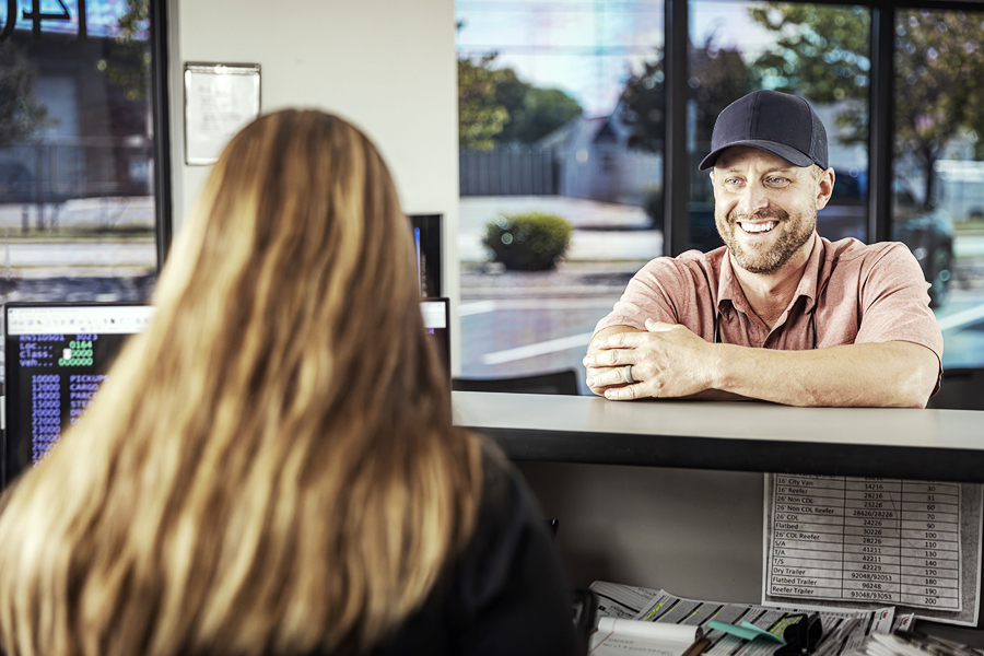 A ryder employee going over the benefits of Rydergyde to a Ryder rental customer