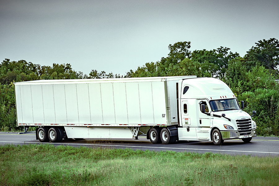 A Ryder truck delivering goods as part of our transportation management solutions
