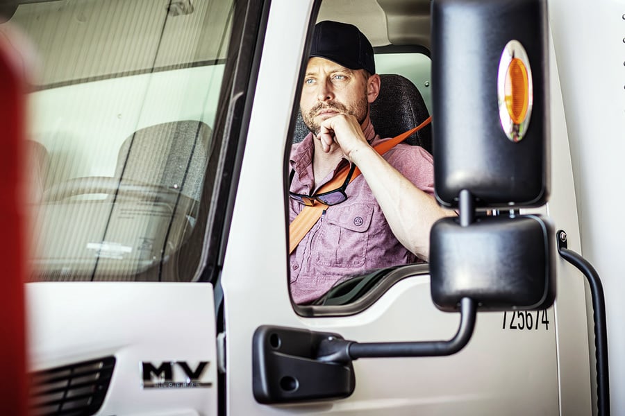 A Ryder expert driving a box truck in for repairs